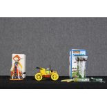 A collection of three Russian tin litho wind up toys. To include an aircraft carousel, doll and car.