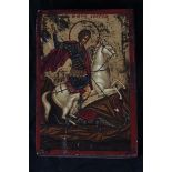 Byzantine Icon. St George slaying the dragon. Oil painting on panel embellished with gilt. Made in