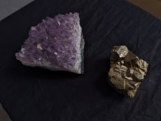 A large Amethyst crystal along with a piece of iron pyrites. The largest measures. H.6 W.10 D.10 cm.