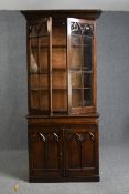 Library bookcase, late 19th century Gothic style oak, in two sections. H.205 W.91 D.55 cm.