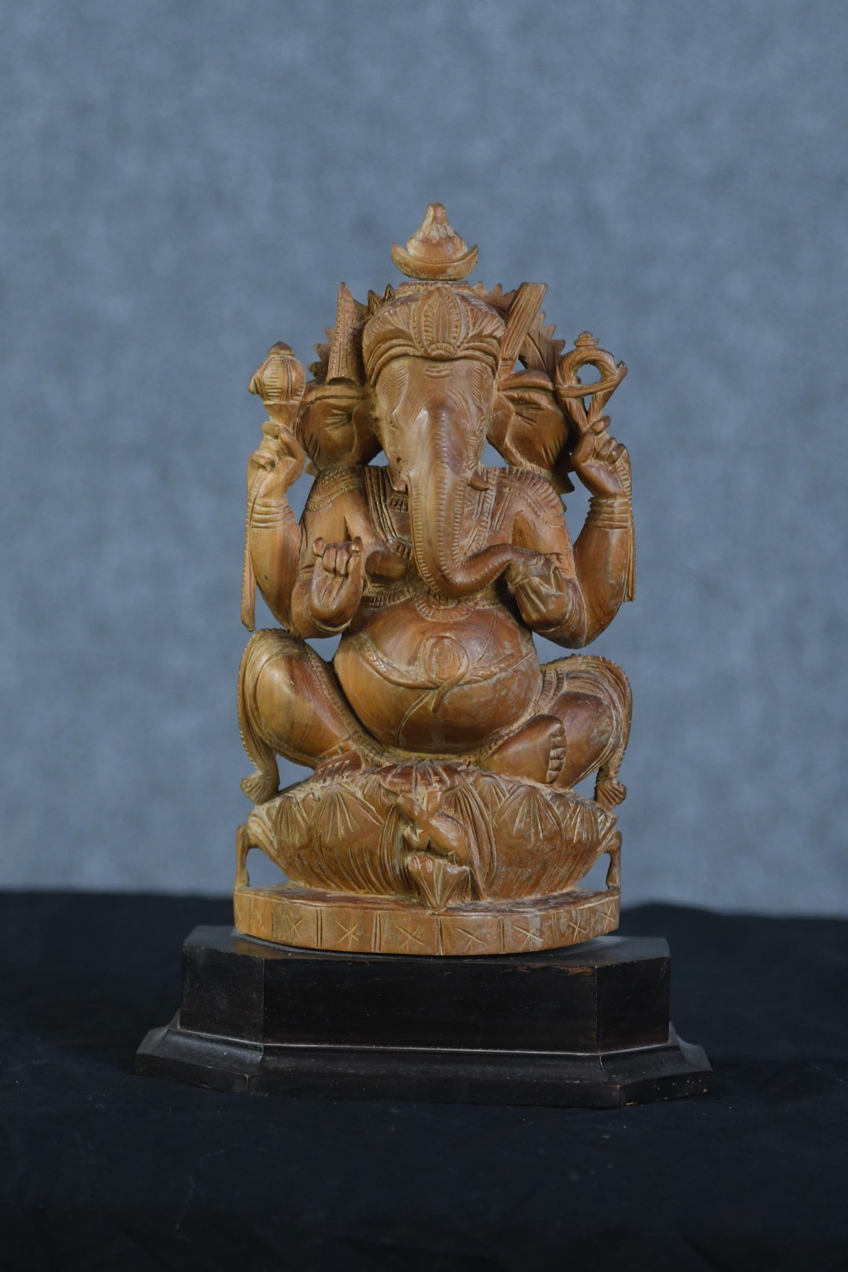 Ganesha Supreme God of the Ganapatya. Carved hardwood figure on a plinth. Probably mid twentieth