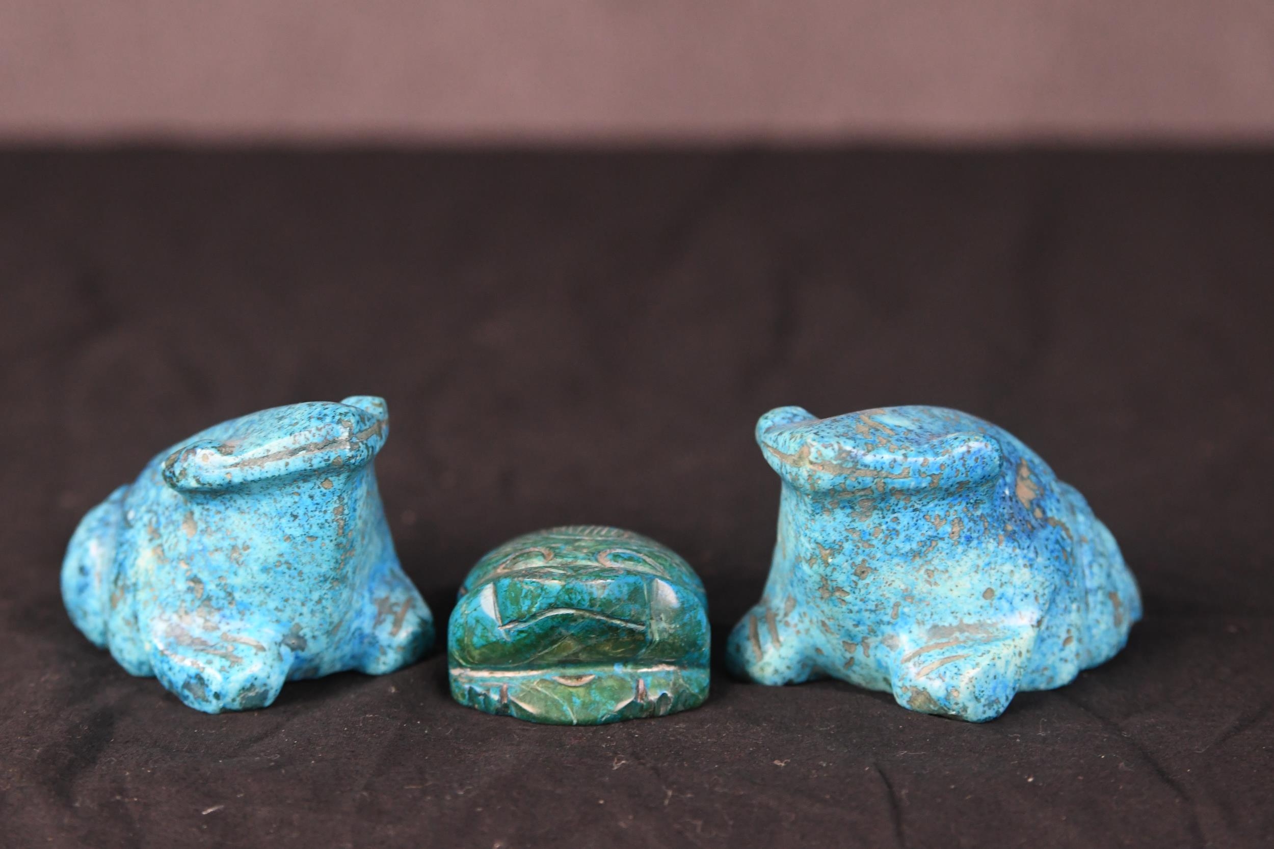 Three Chinese carved blue hardstone frogs of various forms. H.5 x W.8 x D.5 cm