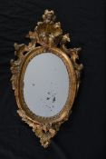 Wall mirror, 19th century giltwood, original plate with Rococo carved masks and foliate detail. H.69