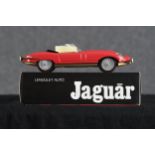 Two Jaguar E Type toy cars. Hungarian. Twentieth century. Each measuring H.8 W.28 D.11 cm.