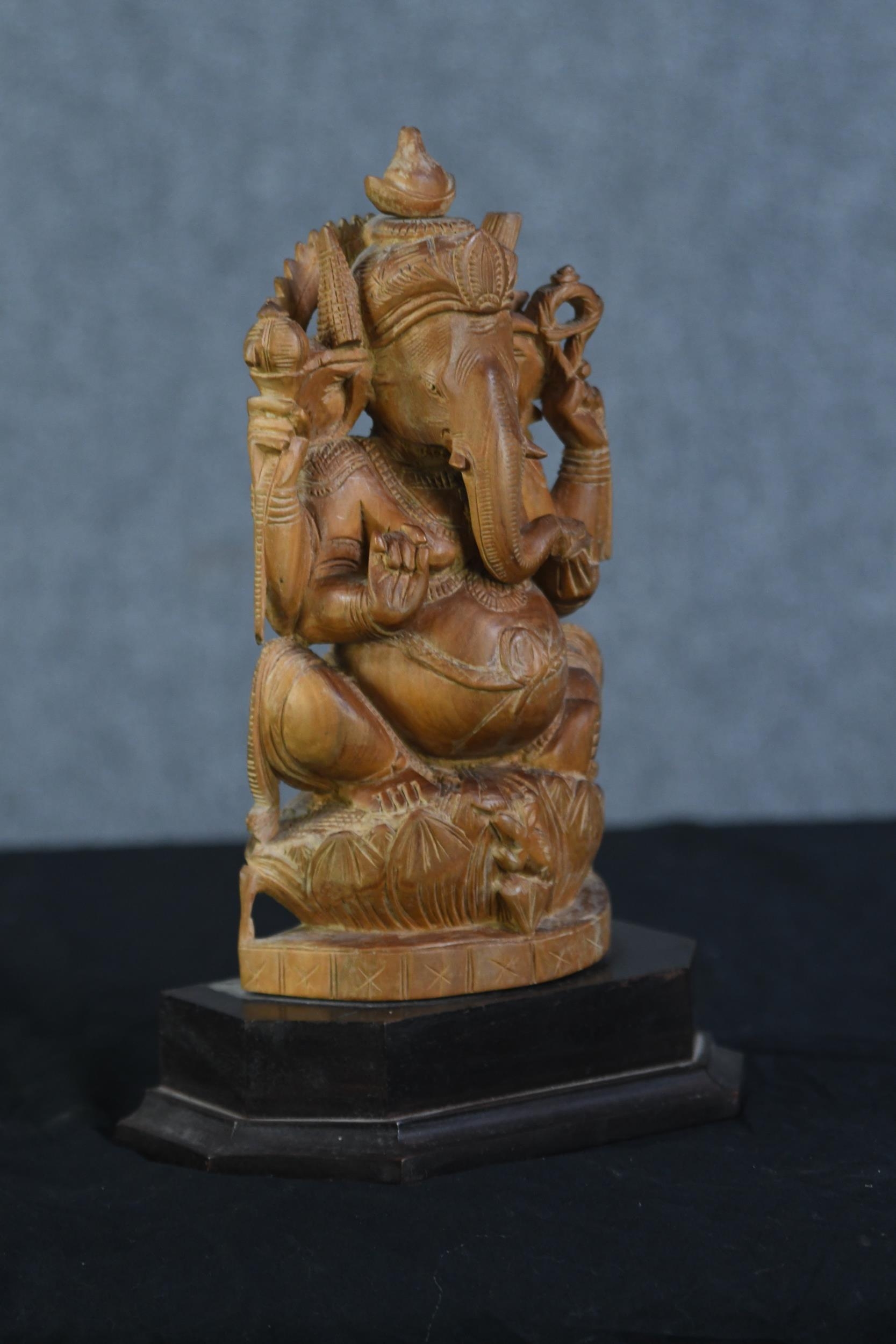 Ganesha Supreme God of the Ganapatya. Carved hardwood figure on a plinth. Probably mid twentieth - Image 2 of 3