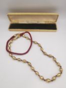 A string of gold plated silver Dhloki beads. L.70CM