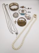 A collection of silver and costume jewellery to include necklaces, brooches, pendants and bracelets.