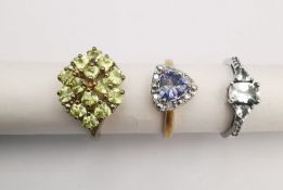 Three 20th century 9 carat gold gem-set rings, a tanzanite and diamond trillion cluster ring, a pale