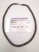 A bronze Japanese Akoya cultured pearl necklace with a 9ct white gold clasp, with certificate of