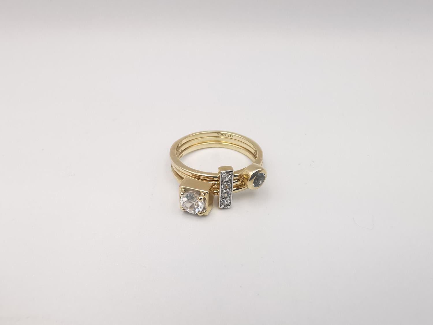 A 9ct yellow gold three part stacking ring set with blue and white zircon. Accompanied by - Image 3 of 3