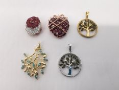 Five gem set silver plated pendants, a rubellite heart strawberry pendant, two tourmaline set tree