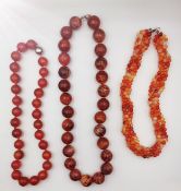 Three knotted carnelian bead necklaces with silver clasps, including a multi strand rope necklace