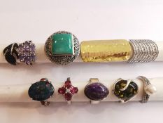 A collection of ten silver and gold plated silver dress rings some set with various gemstones,