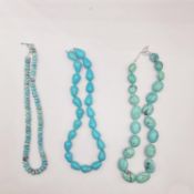 Three 20th century knotted turquoise bead necklaces, including a large oval bead necklace, drop