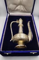 A velvet cased engraved silver Turkish samovar with all over stylised floral and foliate design,