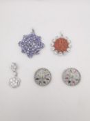 Five gem set silver pendants, one set with fire opal and white topaz, a geometric cluster