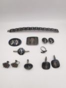A collection of niello work Siamese silver jewellery , including a belt buckle, pair of clip