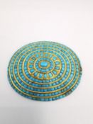 An early 20th century Indian turquoise mosaic inlaid floral cluster oval plaque with yellow metal