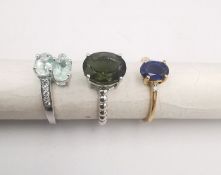Three 20th century 9 carat gold gem-set rings, with certificates. A Siberian emerald and white