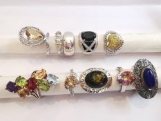 A collection of ten silver and gold plated silver dress rings some set with various gemstones,