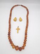 A collection of amber jewellery, an antique graduated amber bead necklace with screw barrel clasp, a