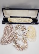 A collection of cultured pearl jewellery, including a boxed multi strand rope necklace with abstract