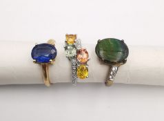 Three 20th century 9 carat gold gem-set rings with certificates. A Kyanite solitaire ring, an