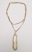 A 24 inch 14 carat yellow gold box chain with 14 carat gold mounted baroque Biwa pearl pendant.