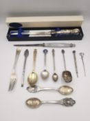 A collection of silver cutlery, including two silver letter openers one with blue agate handle, an