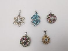 Five silver gem set pendants, one set with Citrine, an abstract blue topaz pendant, two tourmaline