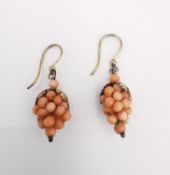 A pair of gold plated silver and coral bead grape earrings. The leaves with engraved detailing.