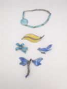 A collection of enamel jewellery, including a Danish pale blue guilloche enamel articulated