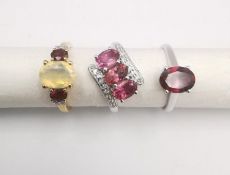 Three 20th century 9 carat gold gem-set rings, with certificates. A rubellite and white zircon