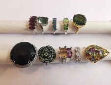 A collection of ten silver and gold plated silver dress rings some set with gemstones, including