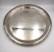 A contemporary circular sterling silver tray with Celtic serpent and motif border. Hallmarked: FH