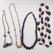Four Lapis lazuli bead necklaces, including a freshwater and lapis lazuli necklace, two Tibetan