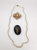Two rolled gold mourning brooches and a string of faux pearls with 9ct rose gold clasp. One mourning