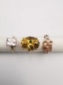 Three 20th century 9 carat gold gem-set rings with certificates. A solitaire Kunzite ring, a large