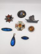 A collection of silver antique brooches and a pendant. Three morpho butterfly wing and silver