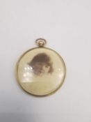 A 9ct yellow gold framed double sided circular locket pendant. Hallmarked:John Collard Vickery,