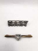Two brooches, a diamond set heart shaped 9ct yellow gold bar brooch along with a paste set white