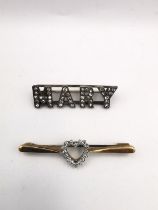 Two brooches, a diamond set heart shaped 9ct yellow gold bar brooch along with a paste set white