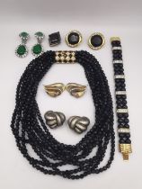 A collection of costume jewellery, including a Ciner black glass multi strand necklace, bracelet and