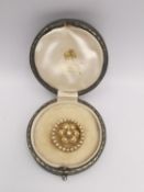 A early 20th century gilded leather cased Asprey and Co. yellow metal (tests as 18ct) and pearl