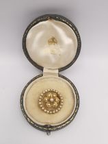 A early 20th century gilded leather cased Asprey and Co. yellow metal (tests as 18ct) and pearl