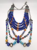 Two early 20th century Arabic silver and gemstone bead multi strand collar necklaces. One Lapis