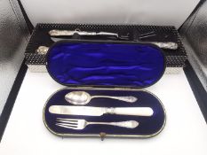 A boxed silver handled kings pattern carving set along with a leather cased Victorian engraved
