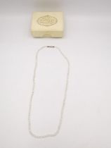 A 19th century seed pearl necklace with 9ct rose gold push barrel clasp. Stamped 9ct. L.40cm