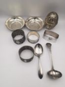 A collection of silver items, including a repousse white metal egg box, two Egyptian silver dishes