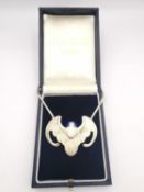 Jocelyn Burton, a boxed silver Chinese lucky bat pendant with lapis lazuli set eyes, on silver snake
